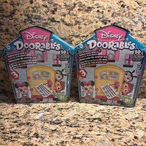 2 unopened Disney Doorables Surprise Packs w 5,6 or 7 figures in each box